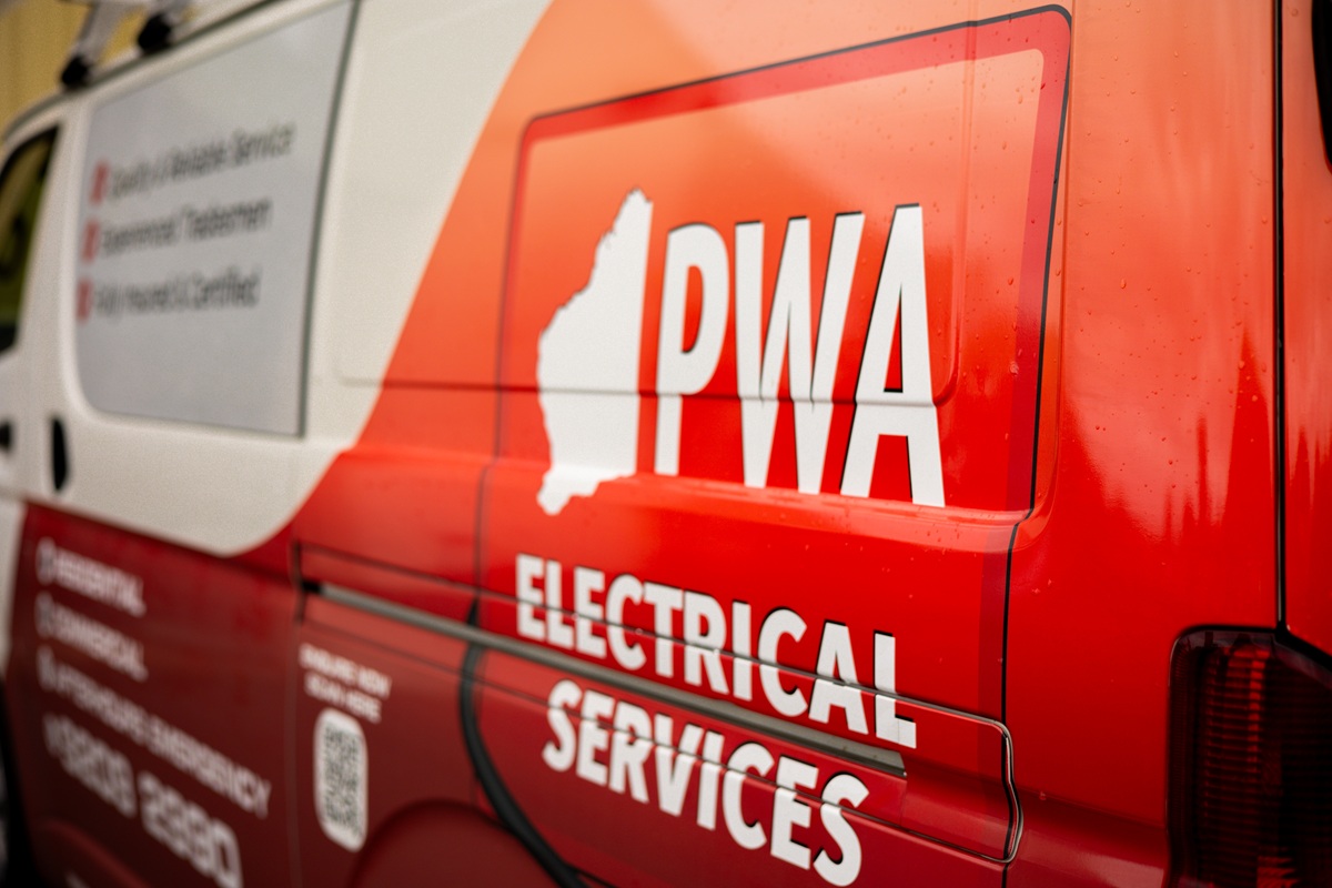 PWA Electrical Services van parked with company branding and logo visible on the side panel.
