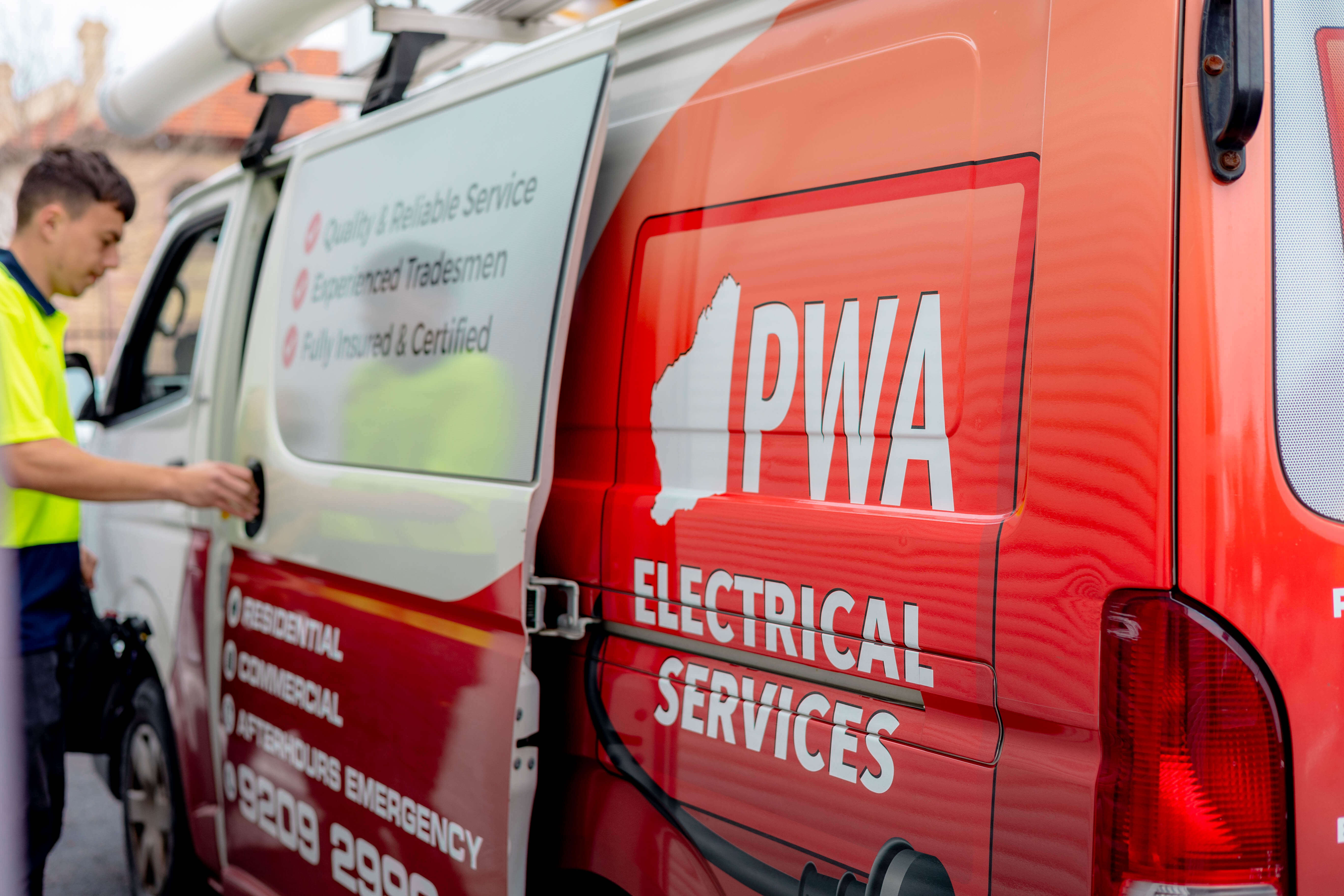 PWA Electrical Services van with company branding and technician preparing equipment